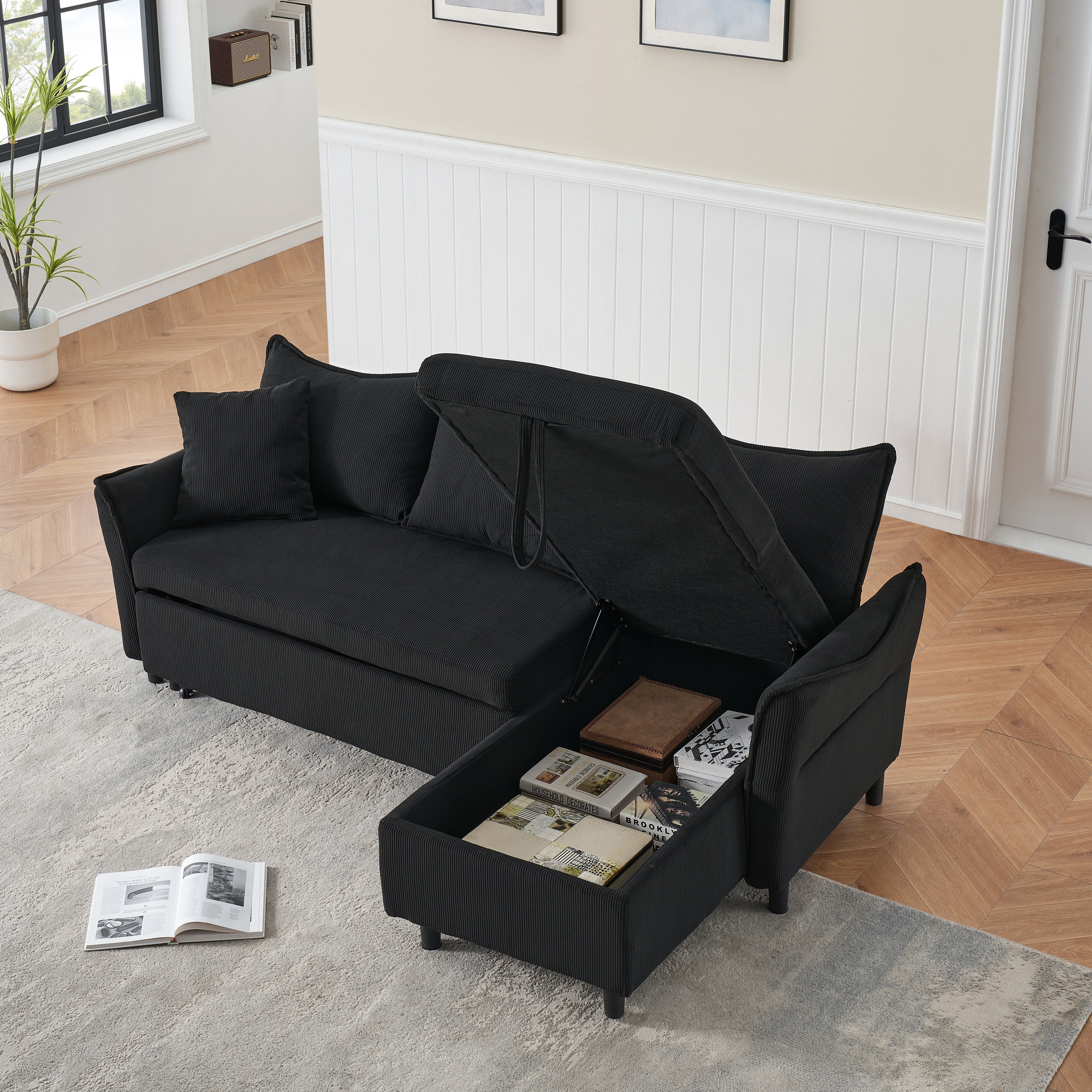 This 80-inch black corduroy L-shaped sofa comes with two small throw pillows that can be converted into a sofa bed for storage--6