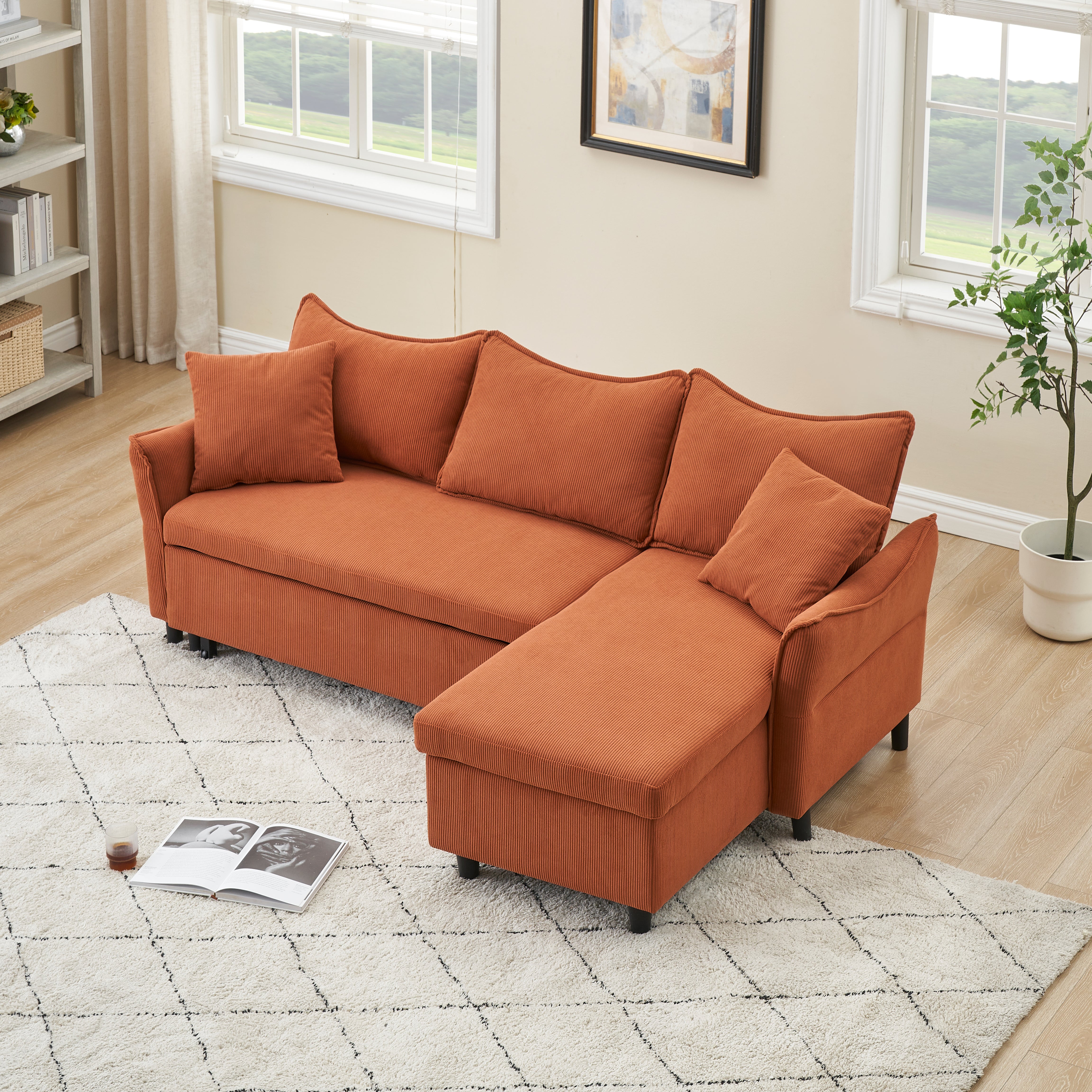 This 80-inch orange corduroy L-shaped sofa comes with two small throw pillows that can be converted into a sofa bed for storage--3