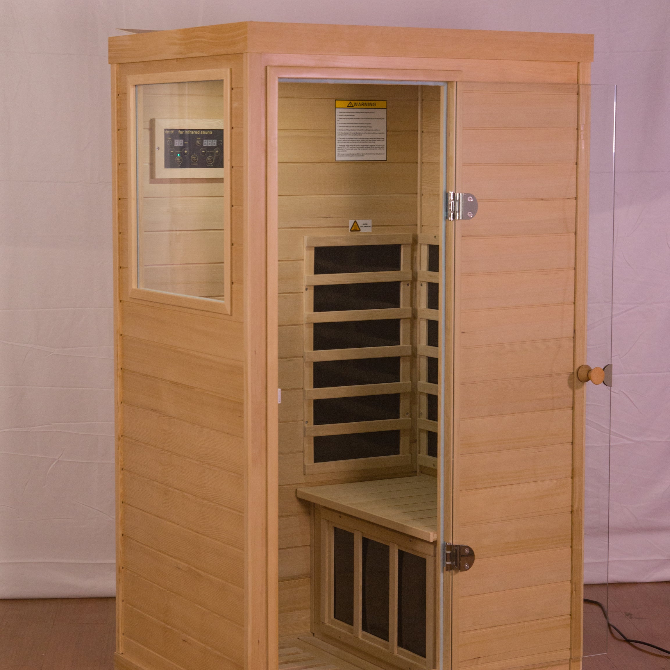 Hemlock Mini one person far infrared door on the left of the indoor sauna room--1