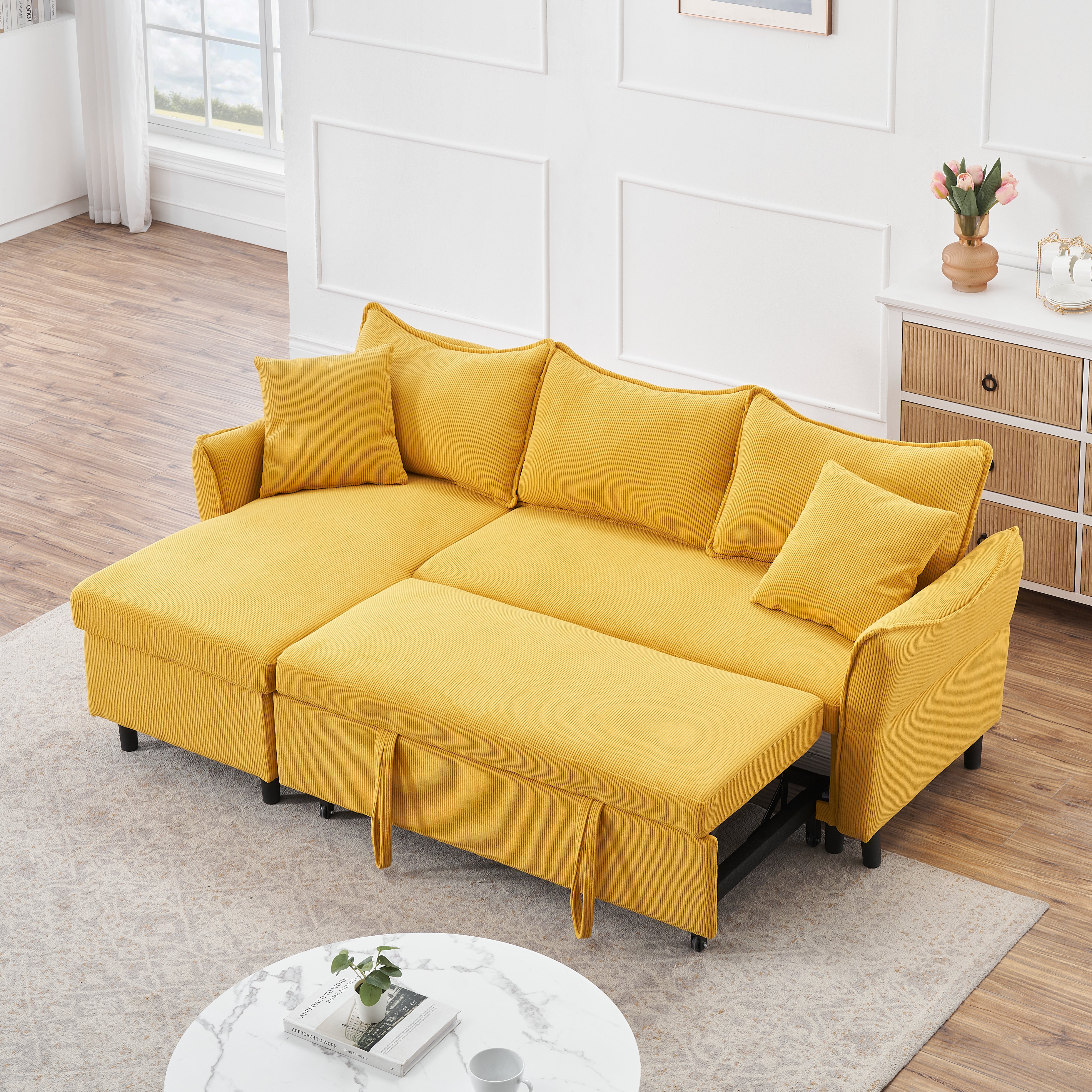 The 80-inch yellow corduroy L-shaped sofa comes with two small throw pillows that can be converted into a sofa bed for storage--1